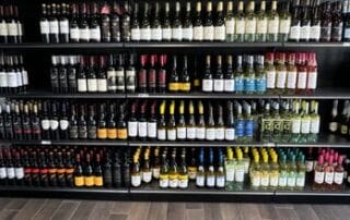 Shelves filled with various wine bottles