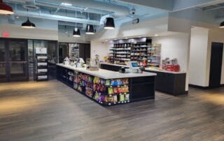 Modern convenience store with snacks and registers.