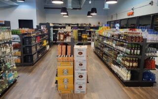 Liquor store interior with shelves of bottles.