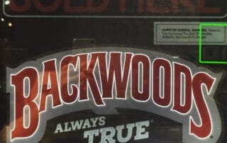 Backwoods cigars sign with health warning.
