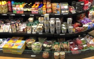 Supermarket refrigerated section with various food and drinks